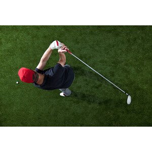 Fotografie A golfer swinging a golf club, overhead view, fStop Images - Halfdark, 40 × 26.7 cm