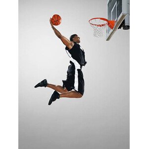 Fotografie Basketball player dunking ball, low angle view, Blake Little, 30 × 40 cm