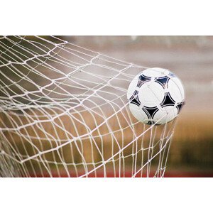Fotografie Football Trapped in a Goal Net, Close-Up, Cocoon, 40 × 26.7 cm