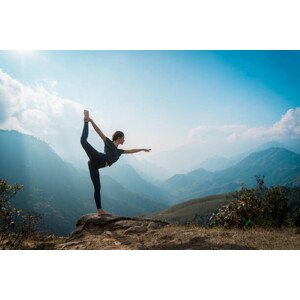 Fotografie Woman training yoga, mountains on background, Zulman, 40 × 26.7 cm
