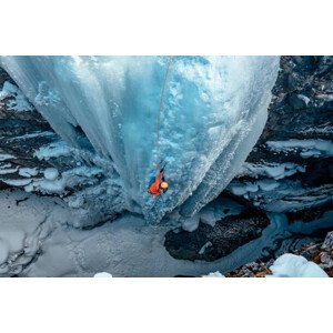 Fotografie A woman ice climbs up a, Alex Ratson, 40 × 26.7 cm